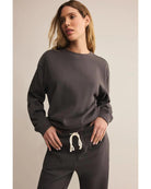 washed black sweatpants with a white rope tie