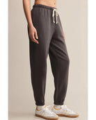 washed black sweatpants with a white rope tie