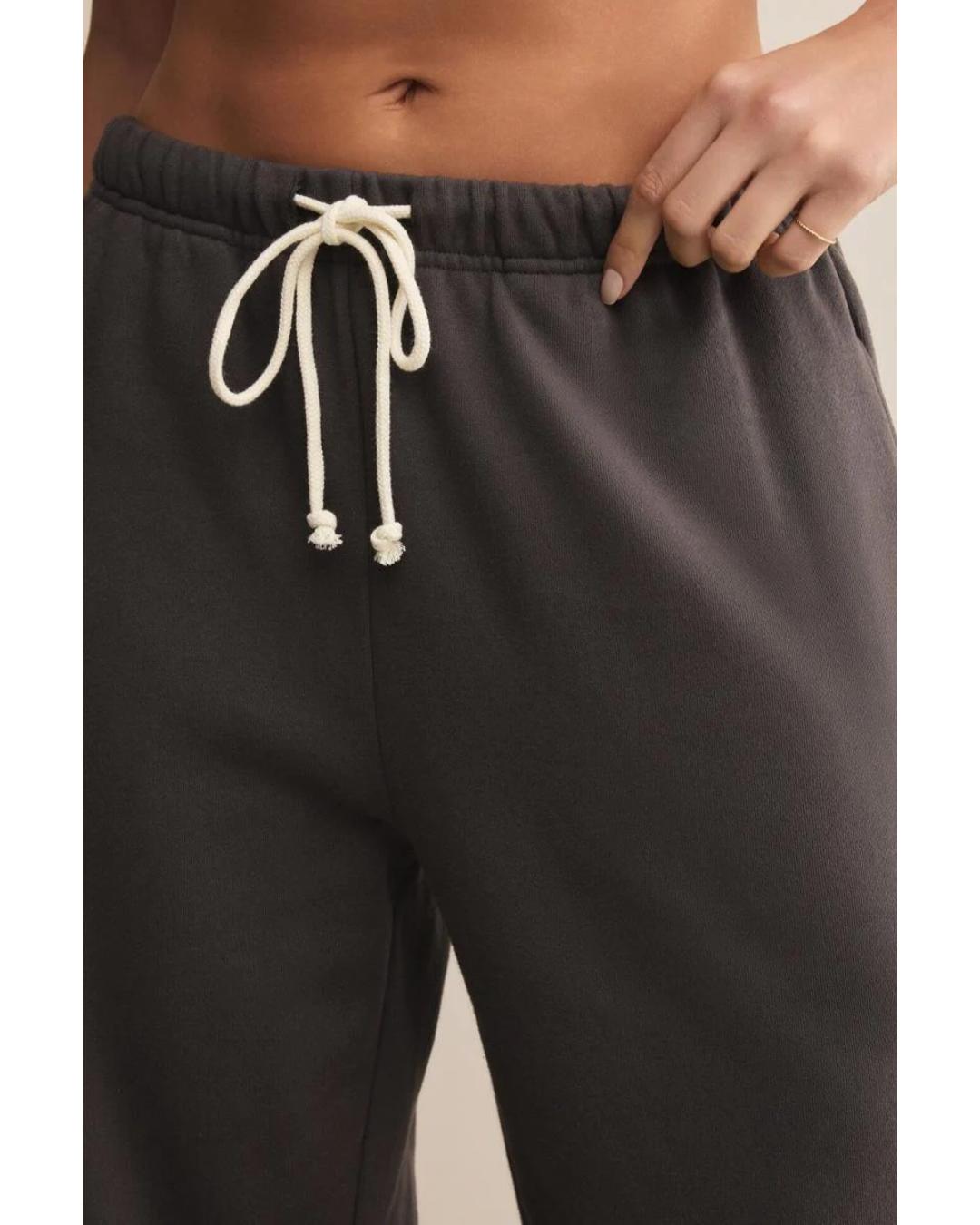 washed black sweatpants with a white rope tie