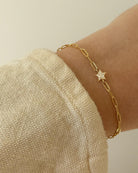 gold chain link bracelet with a star