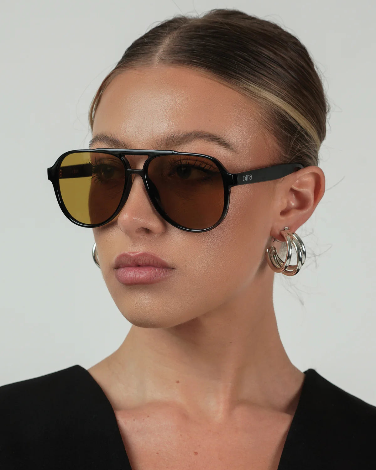 black aviator sunglasses with green lenses