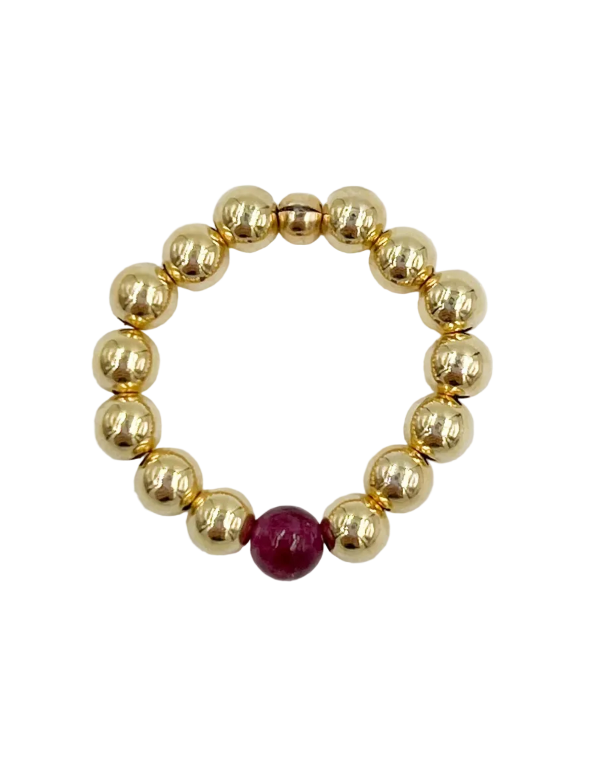 gold beaded ring with garnet stone in the middle