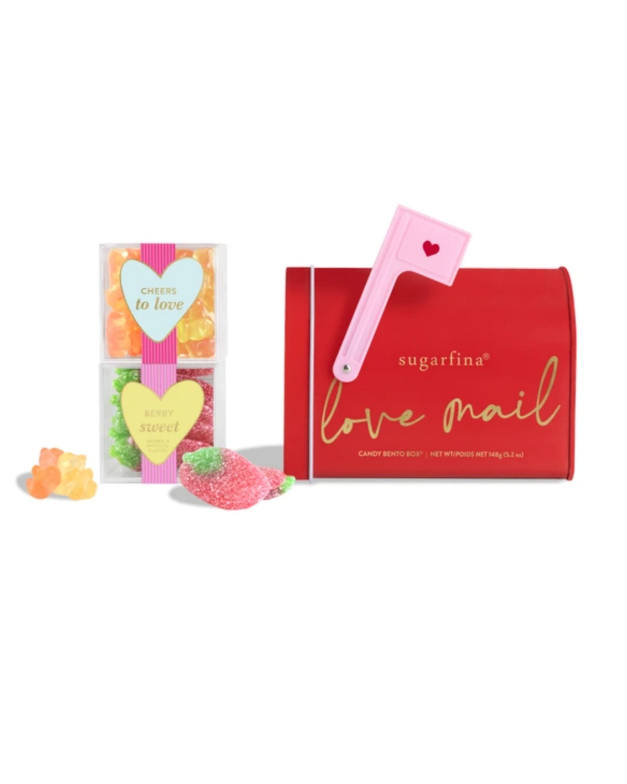 sugarfina 'love mail' candy box with pink brush and gummy candies on a white background