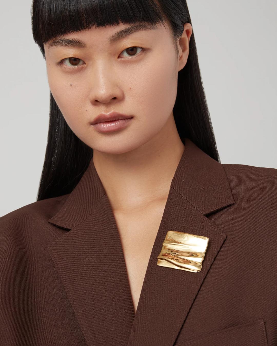 square gold brooch