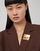 square gold brooch
