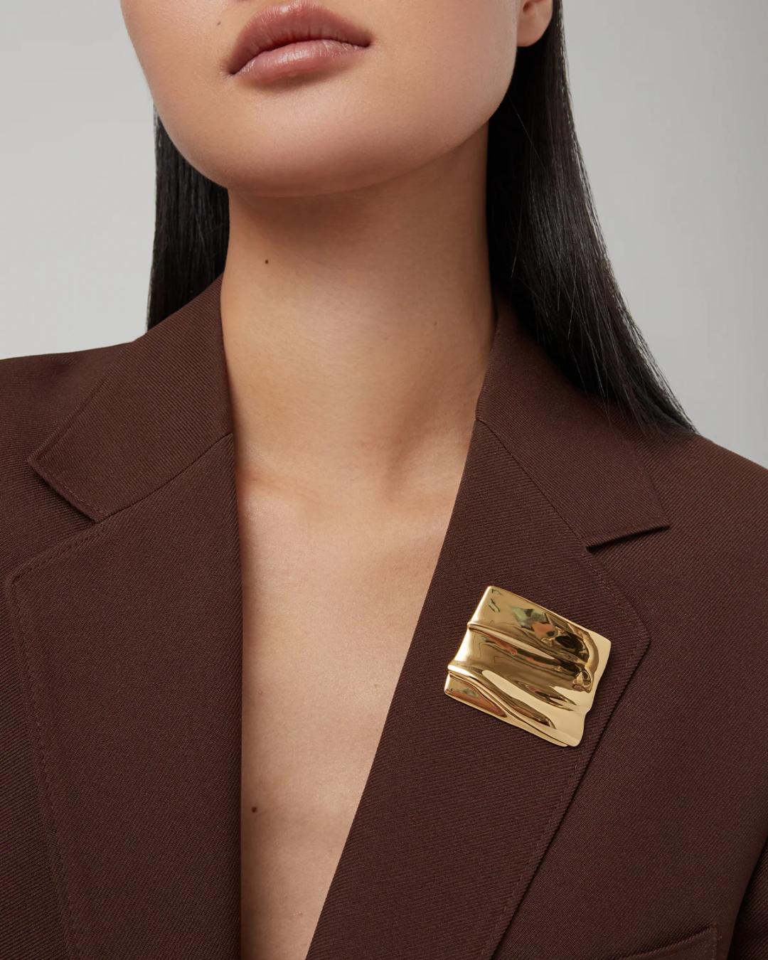 square gold brooch