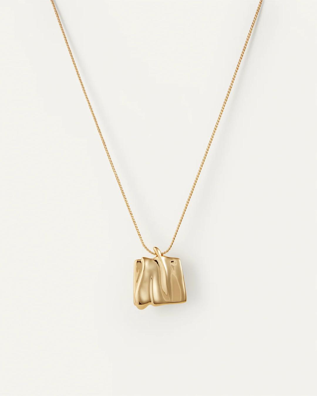large pendant necklace in gold