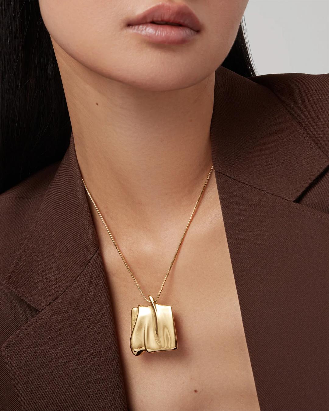 large pendant necklace in gold