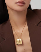 large pendant necklace in gold