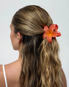 large flower clip in orange and pink