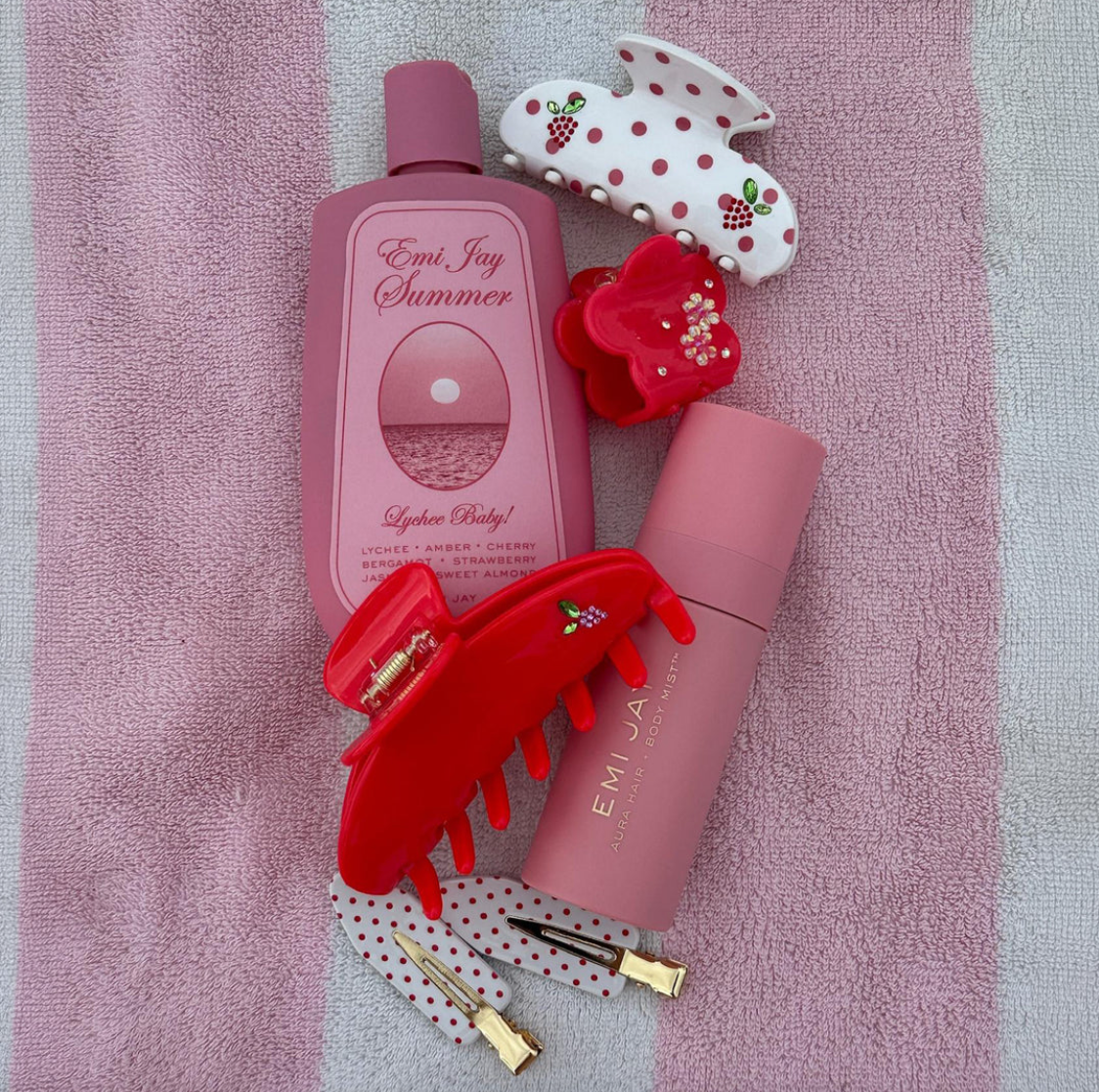 white claw clip with pink polka dots and jeweled strawberry design