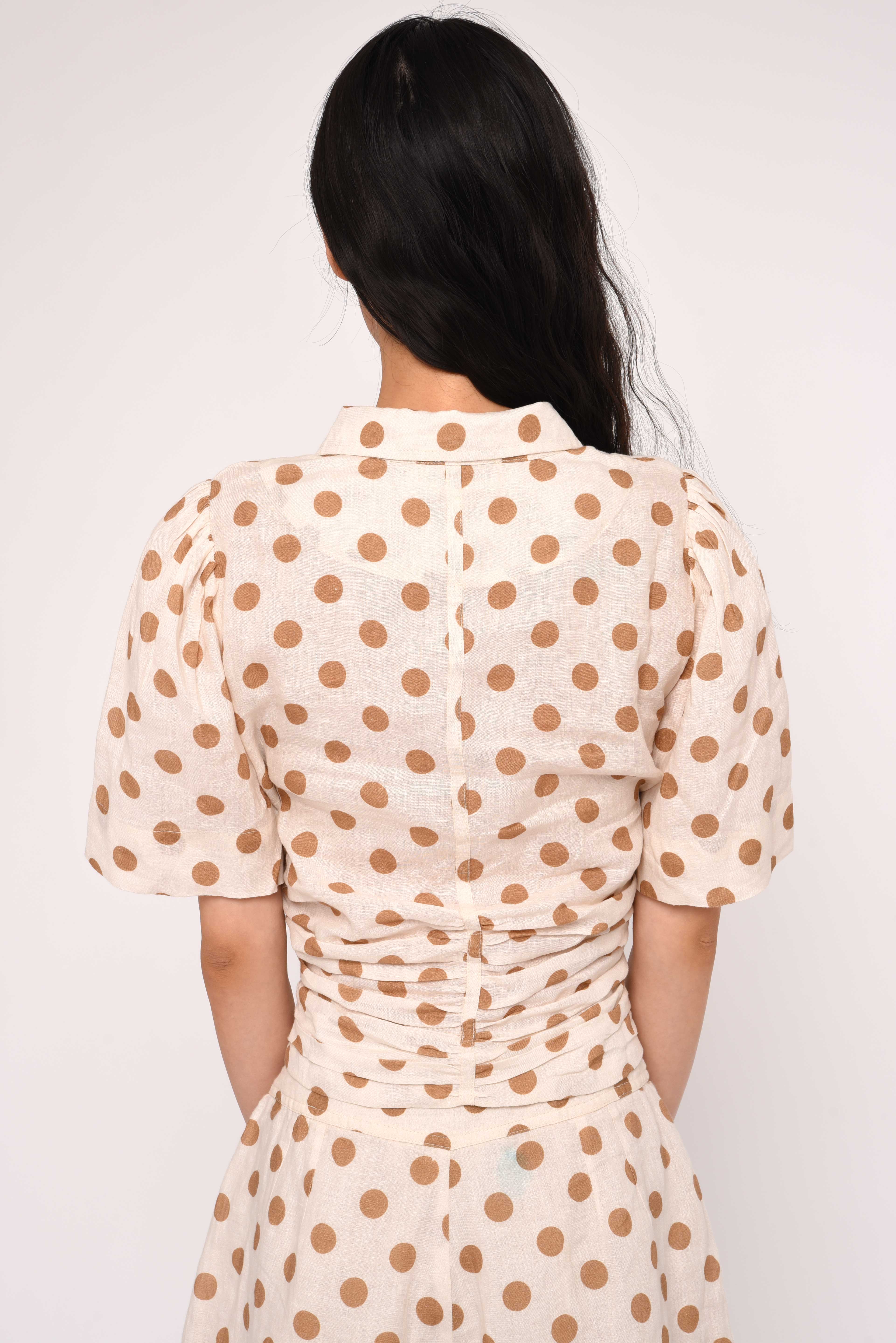 cream blouse with brown polka dots