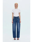 blue denim pants with a bowed leg