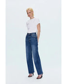 blue denim pants with a bowed leg