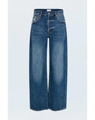 blue denim pants with a bowed leg