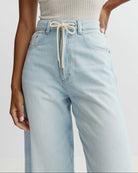 light wash barrel jean with a drawstring