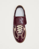 burgundy leather fashion sneaker with a fold over tongue 