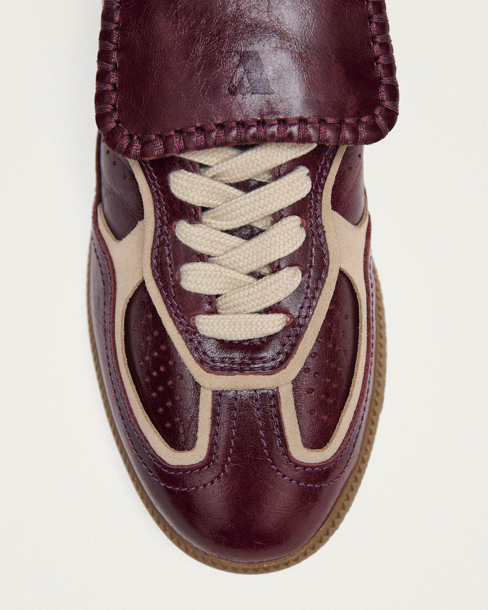 burgundy leather fashion sneaker with a fold over tongue 