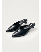 black leather mules with a pointed toe
