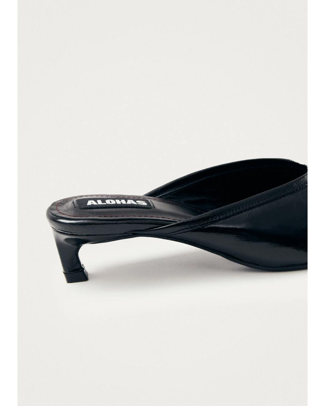 black leather mules with a pointed toe