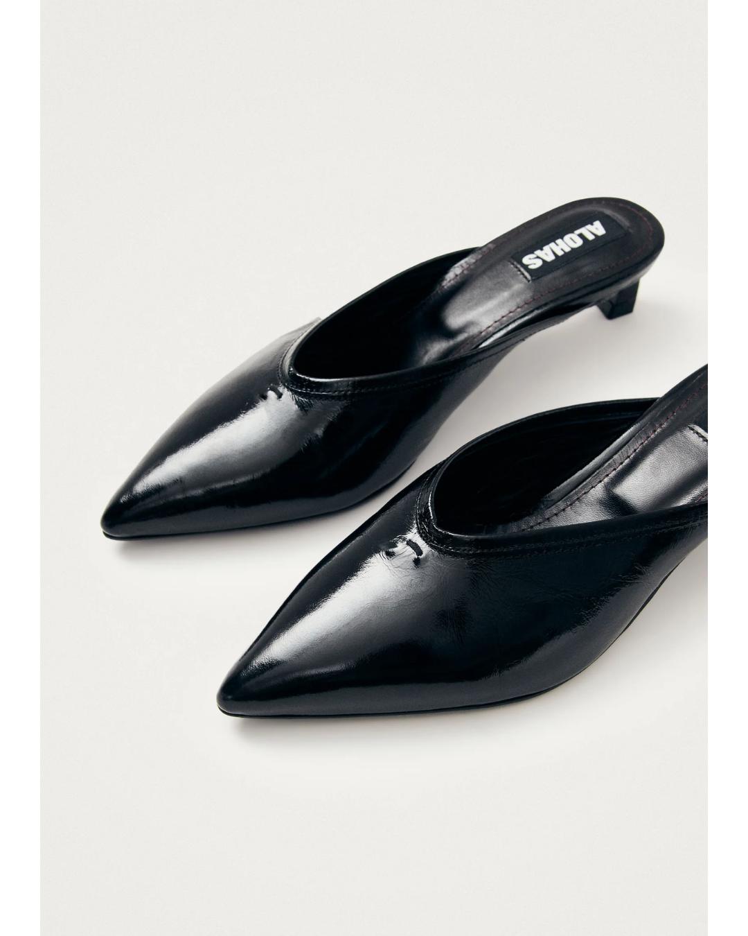 black leather mules with a pointed toe