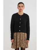 black cardigan with gold buttons