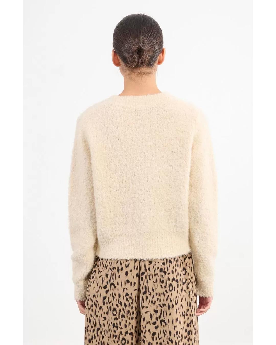 cream colored cardigan with gold buttons