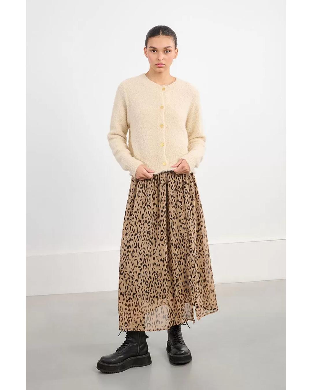 cream colored cardigan with gold buttons