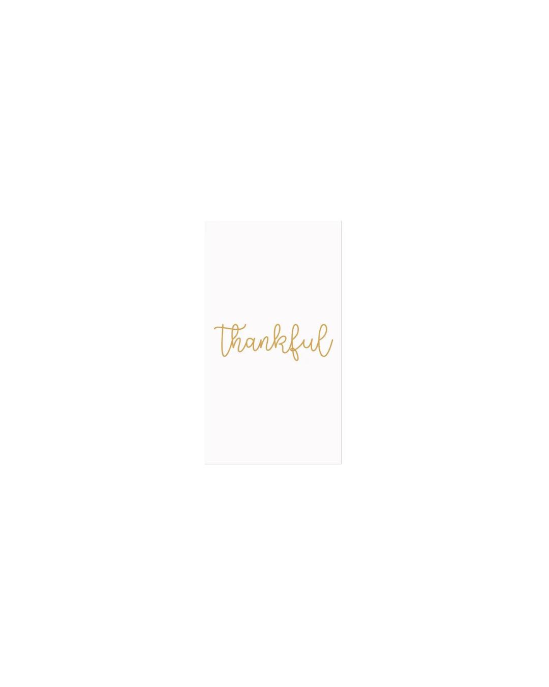 white paper napkins with thankful written in gold