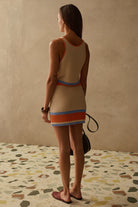 mini knit skirt in cream with blue and orange stripes at the bottom
