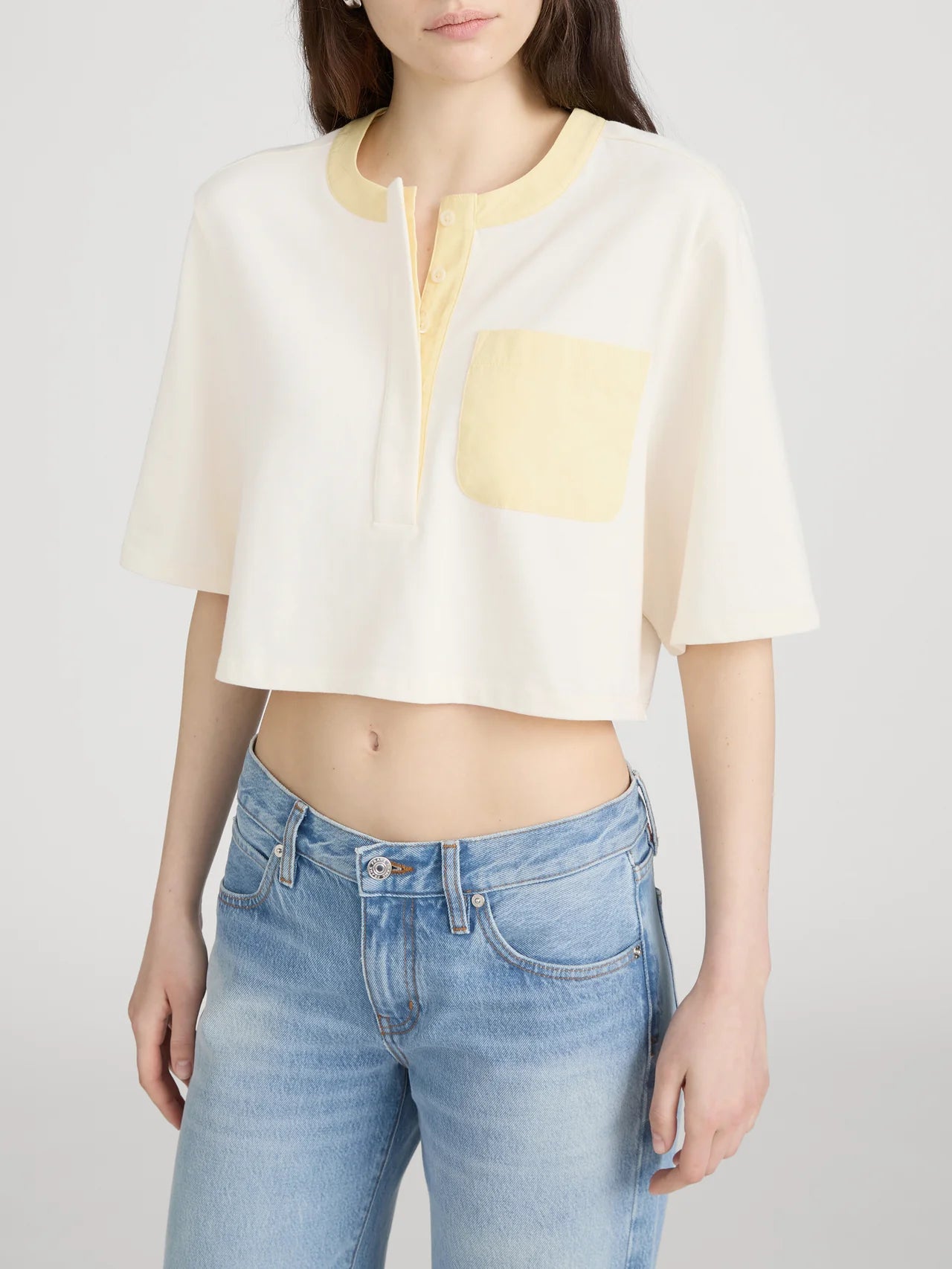 cropped cream top with yellow pocket