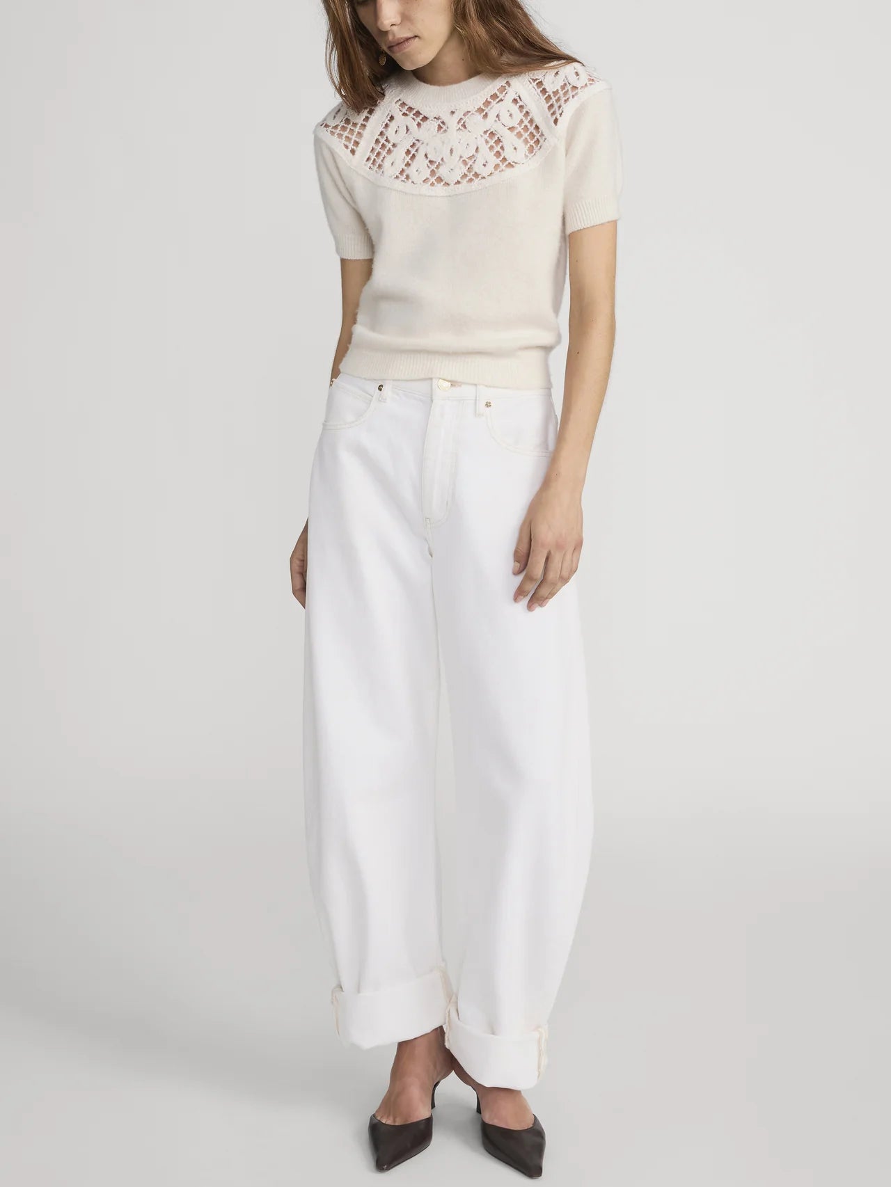 white denim pant with a bubble or curve leg