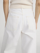white denim pant with a bubble or curve leg