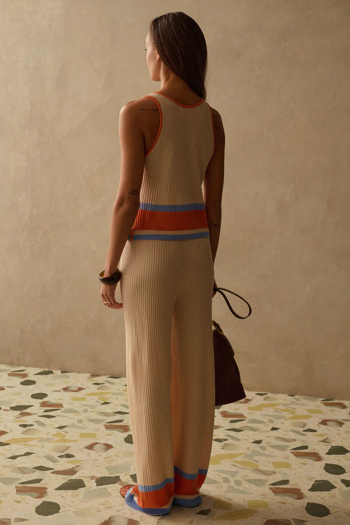 cream knit tank top with orange and blue stripes on the bottom 