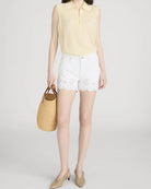 white shorts with eyelet detail on bottom