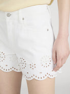 white shorts with eyelet detail on bottom
