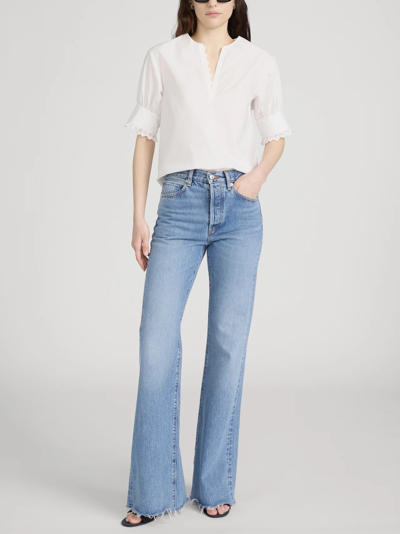 white short sleeve blouse with detail on the sleeves