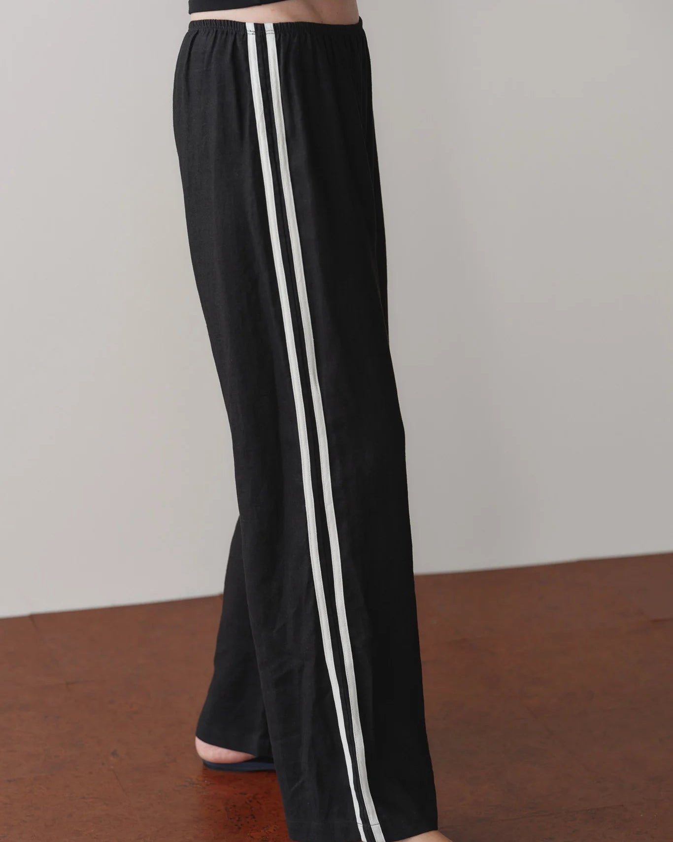 black crop pant with white stripe down the sides