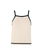 Woman wearing a beige tank top and pants with black trim