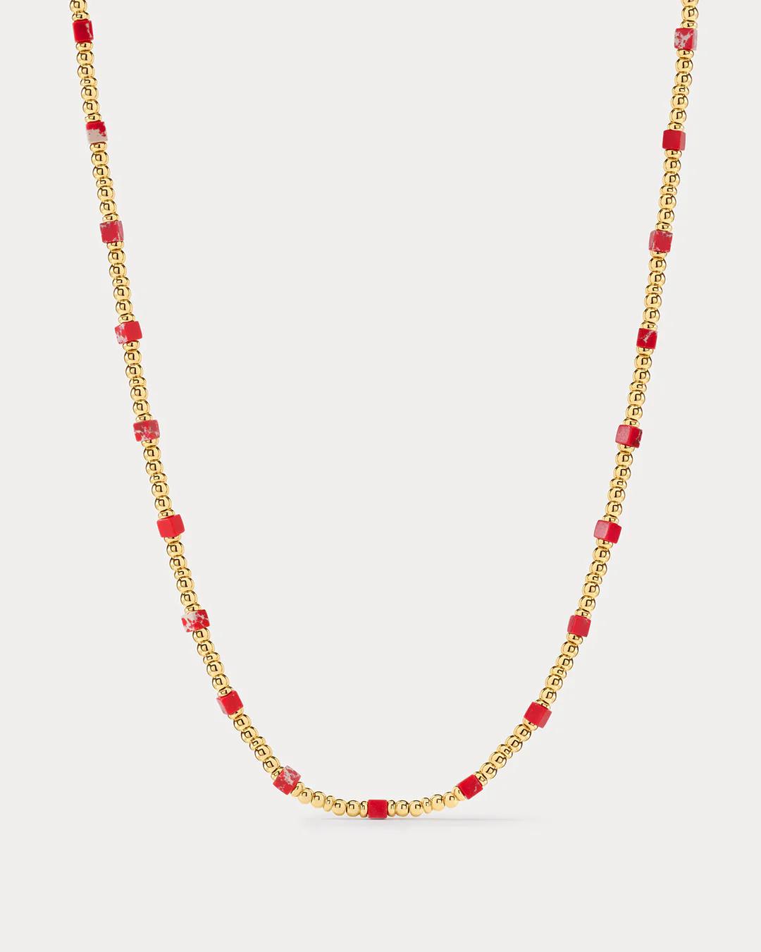 Necklace with gold chain and red beads