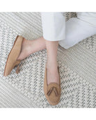 tan slipper shoe with tassels