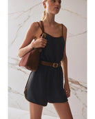 brown leather belt with round gold buckle