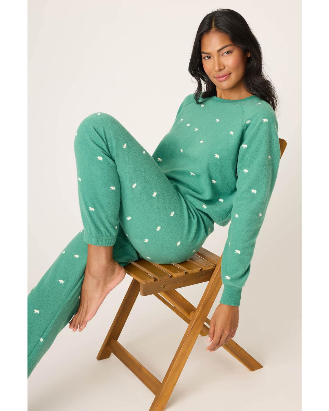 green pj set with bears all over in white