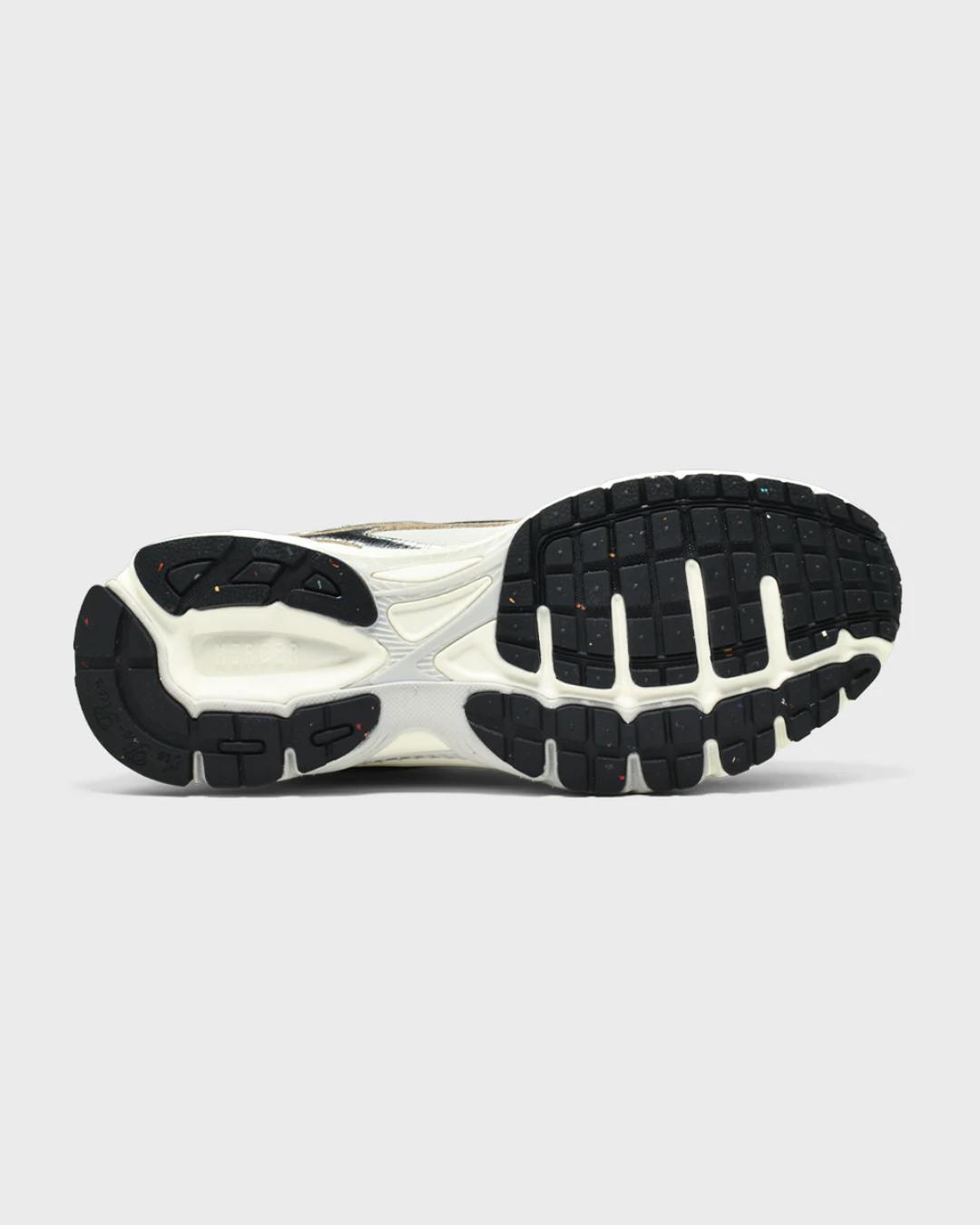 white running shoe with silvers accents