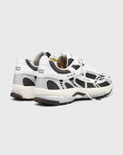 white and dark brown running shoe