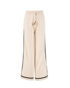 wide leg knit pant in beige with a black stripe on the sides