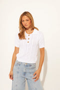 white cable knit short sleeve top with collar and three buttons