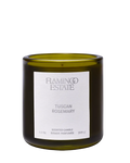 candle in green glass container