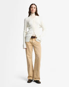 tan denim pants with a relaxed leg