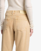 tan denim pants with a relaxed leg